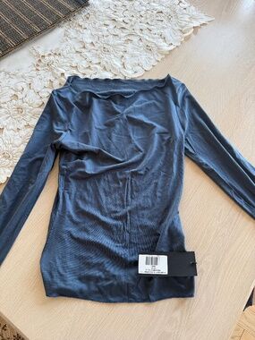A vintage fit semi sheer longsleeve top